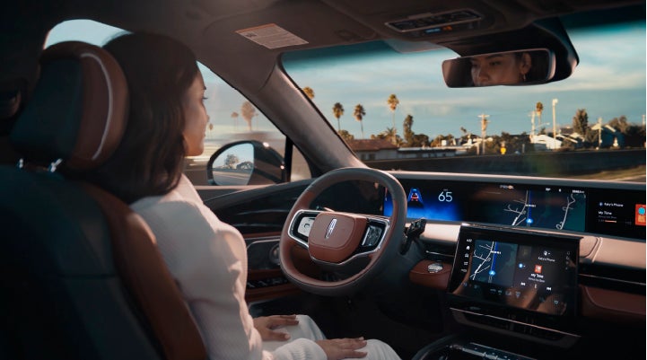 A person is shown driving hands-free on the highway with available Lincoln BlueCruise technology. | Bozard Lincoln in Saint Augustine FL