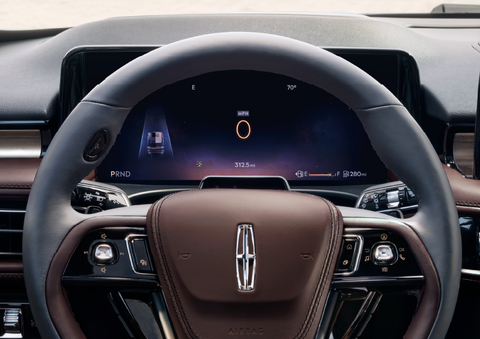 The steering wheel of 2025 Lincoln Aviator® SUV is shown with black and brown accents. | Bozard Lincoln in Saint Augustine FL