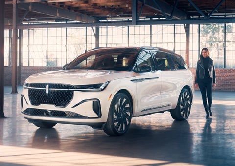 A person approaches a 2025 Lincoln Nautilus® SUV. | Bozard Lincoln in Saint Augustine FL