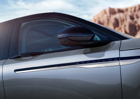 Blue lettering on the side of the vehicle that reads nautilus indicates the available hybrid powertrain. | Bozard Lincoln in Saint Augustine FL