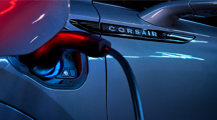 A charger plugged into the charging port of a 2025 Lincoln Corsair® Plug-in Hybrid model. | Bozard Lincoln in Saint Augustine FL