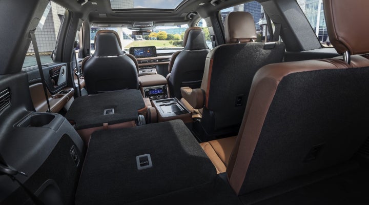 One side of the PowerFold® third-row seat and a second-row seat are folded forward in the 2026 Lincoln Aviator® SUV. | Bozard Lincoln in Saint Augustine FL