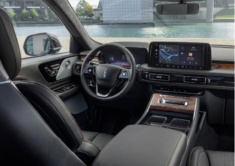 The interior of the 2026 Lincoln Aviator® SUV is shown parked with a view of a harbor through the windshield. | Bozard Lincoln in Saint Augustine FL