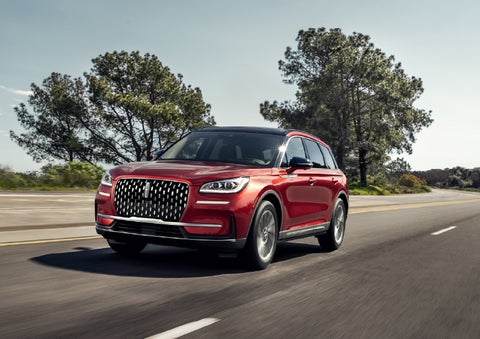 A 2026 Lincoln Corsair® SUV is shown being driven on a country road. | Bozard Lincoln in Saint Augustine FL