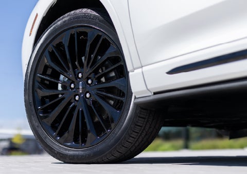 A stylish 20-inch black aluminum wheel of the available Jet Appearance Package is shown. | Bozard Lincoln in Saint Augustine FL