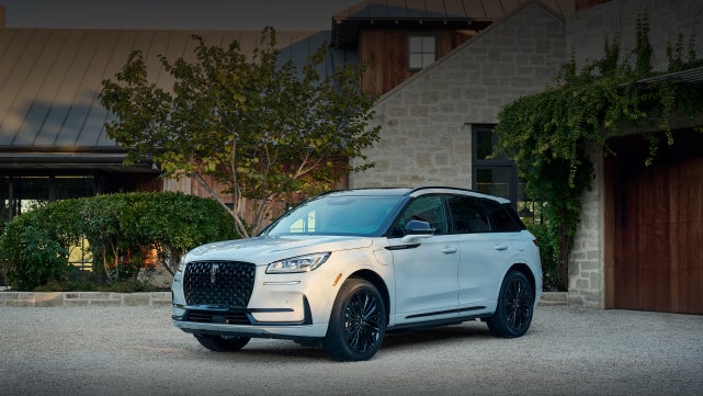 A 2026 Lincoln Corsair® SUV is parked in front off a luxury home. | Bozard Lincoln in Saint Augustine FL