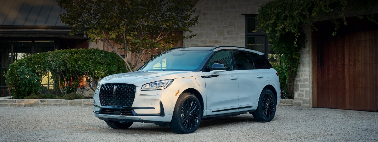 A 2026 Lincoln Corsair® SUV is parked in front off a luxury home. | Bozard Lincoln in Saint Augustine FL