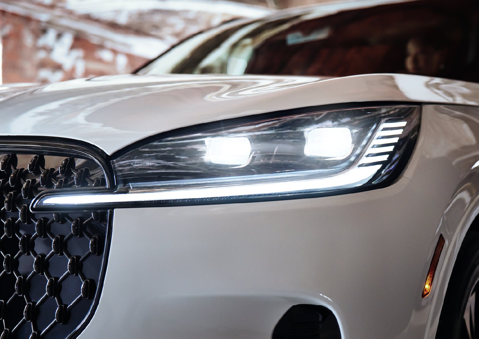 A close-up of a headlamp on the 2027 Lincoln Aviator® SUV is shown. | Bozard Lincoln in Saint Augustine FL