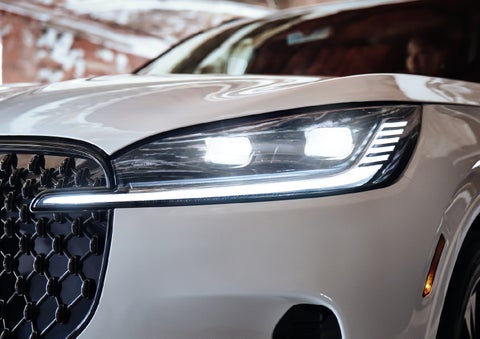 A close-up of a headlamp on the 2027 Lincoln Aviator® SUV is shown. | Bozard Lincoln in Saint Augustine FL