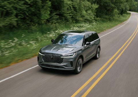 A 2027 Lincoln Aviator® SUV is being driven down a road. | Bozard Lincoln in Saint Augustine FL