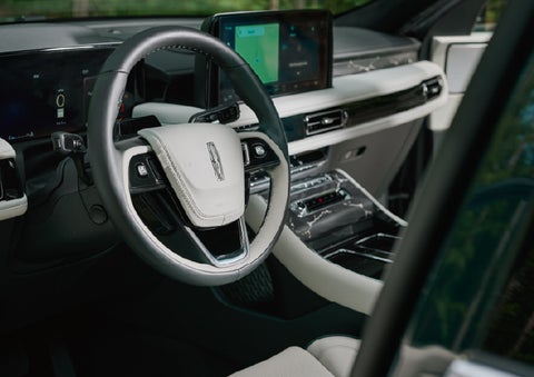 The leather-trimmed steering wheel of a 2027 Lincoln Aviator® Black Label™ SUV. | Bozard Lincoln in Saint Augustine FL